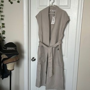 Beige layer over coat